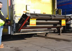 Man operating tail lift.